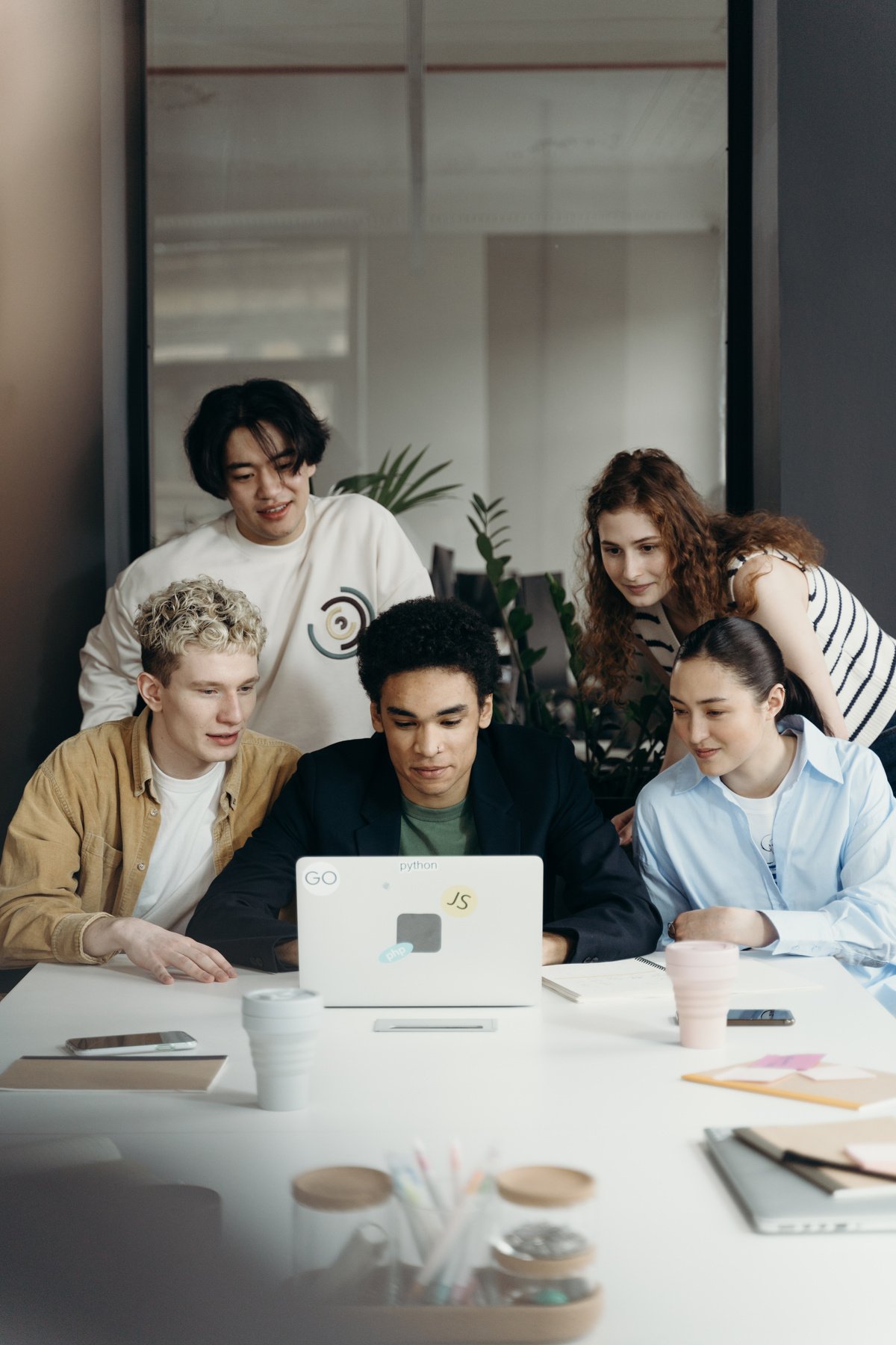 Group of People In Front of a Laptop